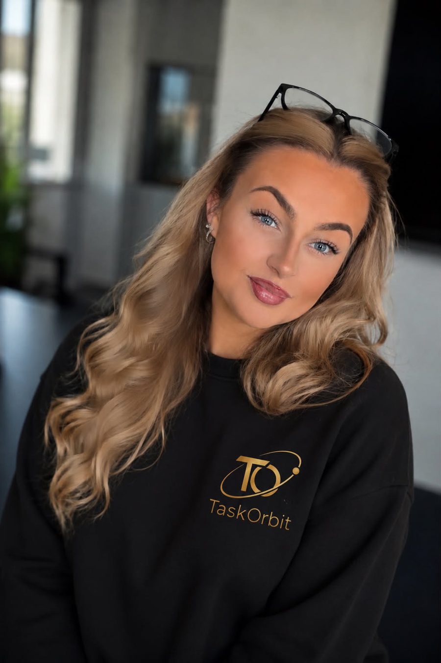 Amy, founder of TaskOrbit, in a TaskOrbit jumper